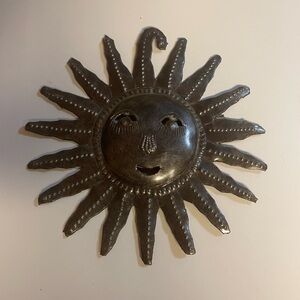 Hanging sun ornament.